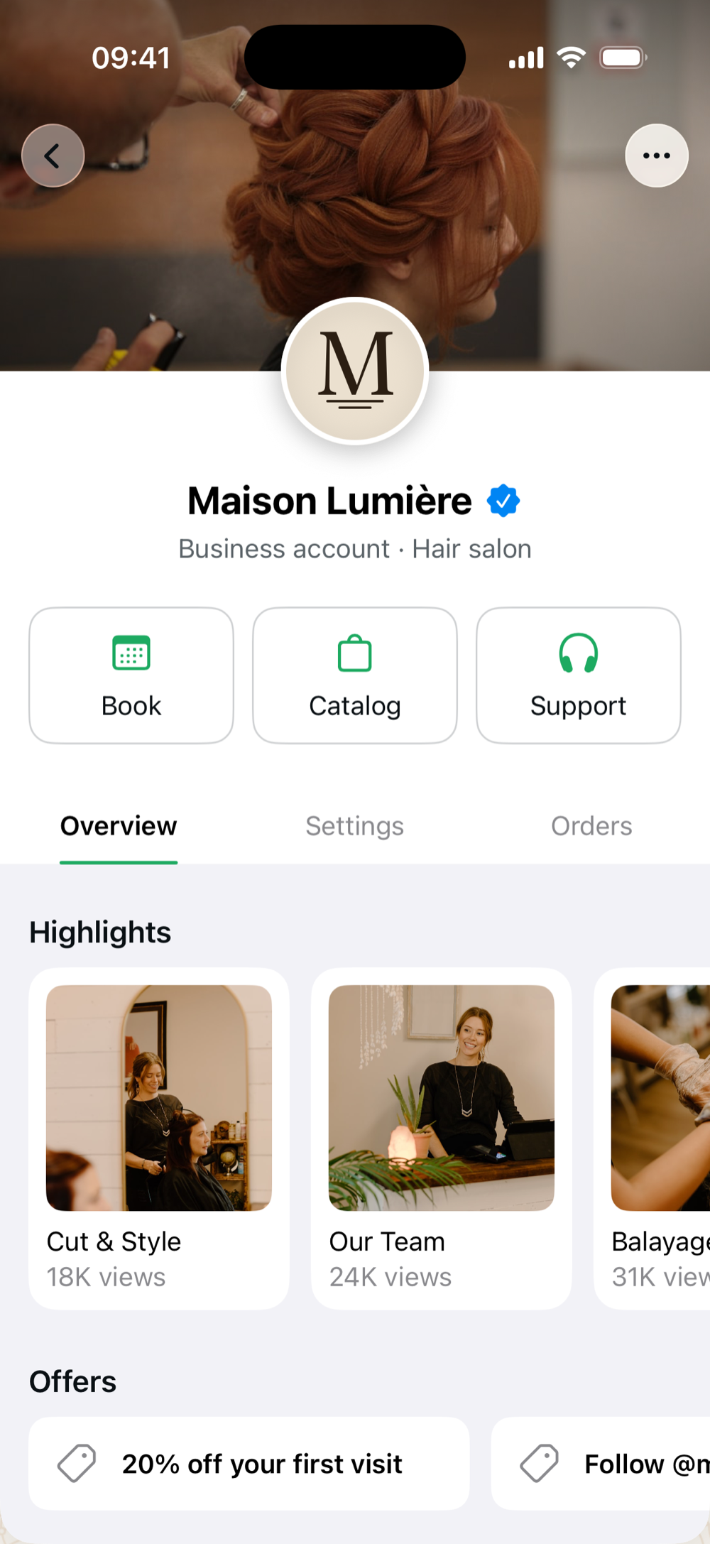 Overview page pulled up over the chat: Maison Lumière header, highlights (Balayage, Cuts, Color), catalog with prices, Book action. Composer still visible beneath.